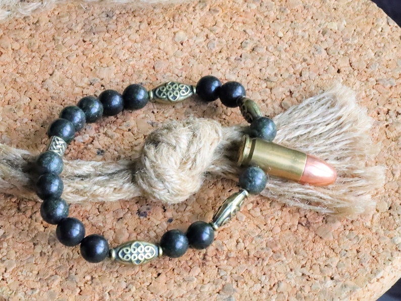 Uncommon real 9mm Luger Bullet bracelet with Strong Serpentine. Bullet Name Meaning: Its Powerful Symbolism, Destiny and Luck.
