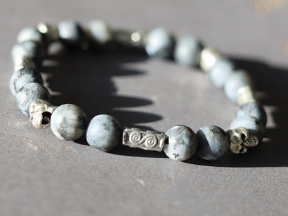 Natural Larvikite/Black Labradorite round beads and Silver Plated Skull Spacer Beads. rotect you in your day to day activities