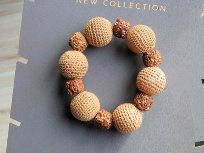 Particularly large Walnut Hand carved Bracelet with Crochet bead light brown. A larger, crocheted bead in light brown.