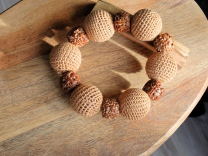 Particularly large Walnut Hand carved Bracelet with Crochet bead light brown. A larger, crocheted bead in light brown.