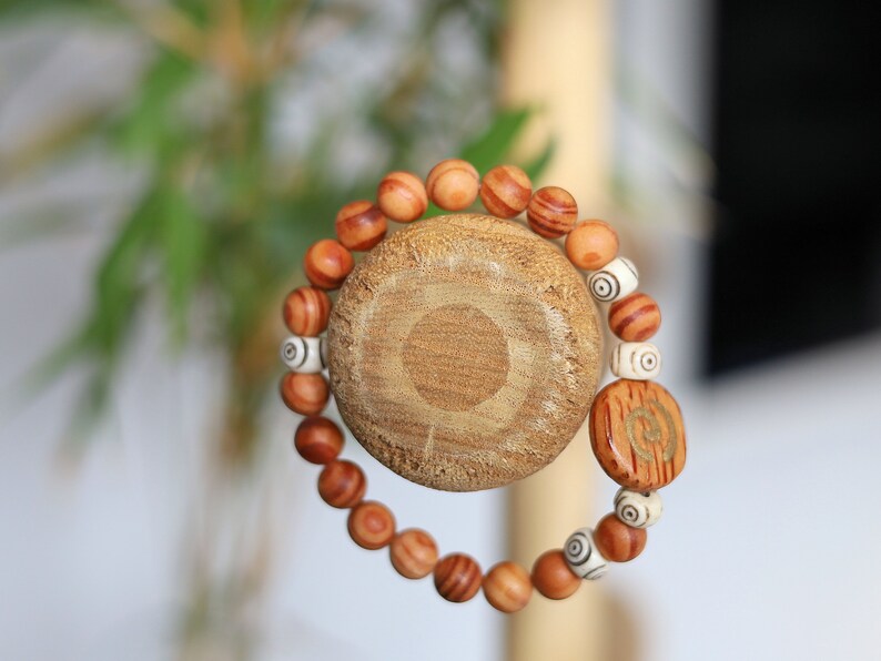 Lightweight unique combination Matte Raja Kayu Wood and Spiral Yak Bone with Spiral brown wood. Symbol of purity, strength and courage