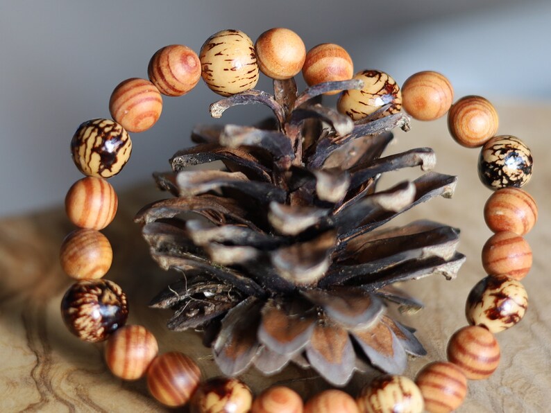 Lightweight rare combination Matte Raja Kayu Wood and muruci beads also come from our purveyor the palm tree. Free offer gift wrapping
