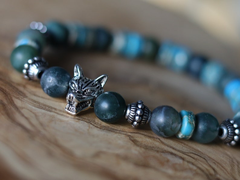 Heishi and Matte Moss Agate Beads bracelets combined with a Wolf Head. Unique, handmade symbolic jewelry that reflects your style & beliefs.