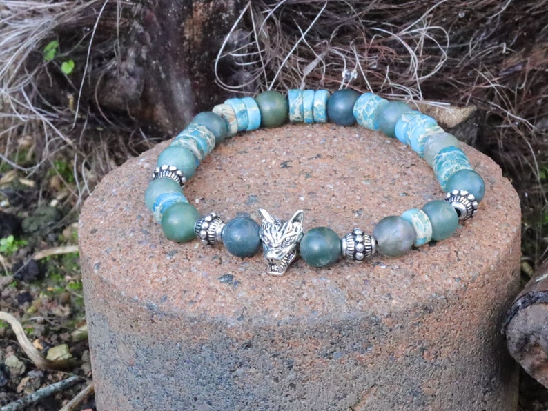 Heishi and Matte Moss Agate Beads bracelets combined with a Wolf Head. Unique, handmade symbolic jewelry that reflects your style & beliefs.