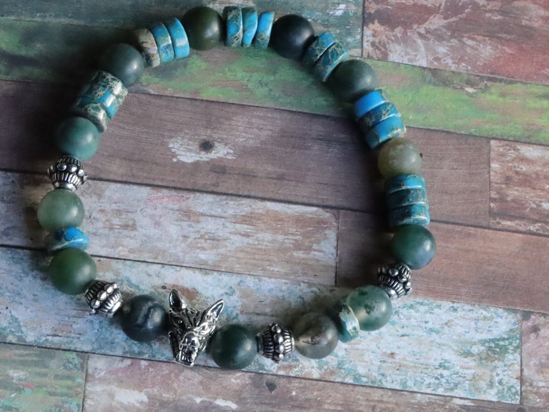 Heishi and Matte Moss Agate Beads bracelets combined with a Wolf Head. Unique, handmade symbolic jewelry that reflects your style & beliefs.