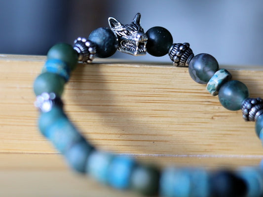Heishi and Matte Moss Agate Beads bracelets combined with a Wolf Head. Unique, handmade symbolic jewelry that reflects your style & beliefs.