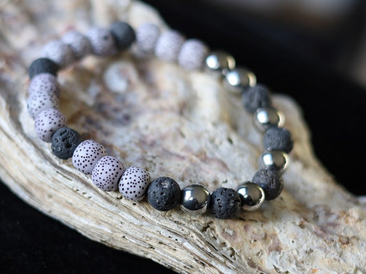 Starmoon Bodhi Barrel bracelet with Lava stones and Hematite crystal. represent rebirth and shedding unneeded layers of emotional attachment
