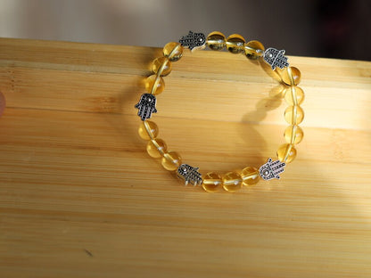 Citrine is a master of one's creativity center combined with Tibetan Style Alloy Hamsa Hand. ENERGIZING CITRINE BRACELET