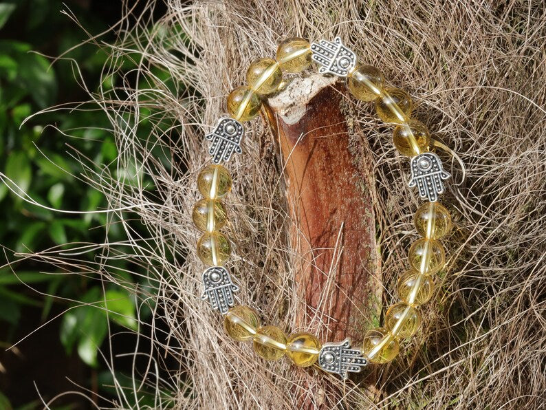 Citrine is a master of one's creativity center combined with Tibetan Style Alloy Hamsa Hand. ENERGIZING CITRINE BRACELET