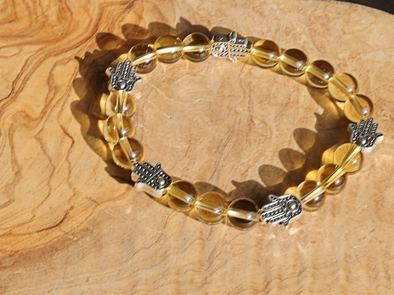 Citrine is a master of one's creativity center combined with Tibetan Style Alloy Hamsa Hand. ENERGIZING CITRINE BRACELET