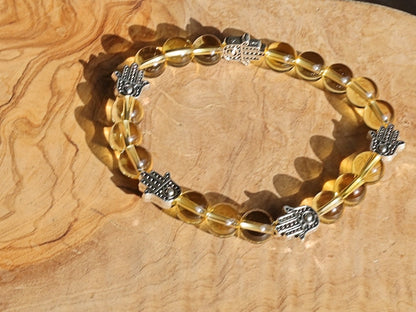 Citrine is a master of one's creativity center combined with Tibetan Style Alloy Hamsa Hand. ENERGIZING CITRINE BRACELET