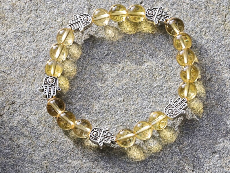Citrine is a master of one's creativity center combined with Tibetan Style Alloy Hamsa Hand. ENERGIZING CITRINE BRACELET