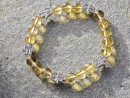 Citrine is a master of one's creativity center combined with Tibetan Style Alloy Hamsa Hand. ENERGIZING CITRINE BRACELET