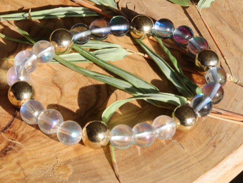 Mystic Aura Quartz Beads with Angel Aura and Metallook Beads Gold. the path of life becomes clear again and the stone gives joy, energy