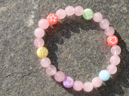 The Bāla Sagrahi Kids Collection. Children's Size 6 mm Rose Quartz Bracelet with kids acryl beads symbols. Gifts for kids!