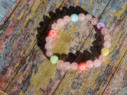 The Bāla Sagrahi Kids Collection. Children's Size 6 mm Rose Quartz Bracelet with kids acryl beads symbols. Gifts for kids!