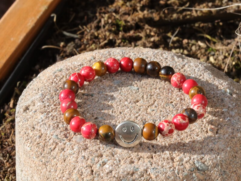 The Bāla Sagrahi Kids Collection. Children's Size Red Emperor Jasper 6 mm Gemstone Bracelet with Tiger eye and Happy Face Bead.