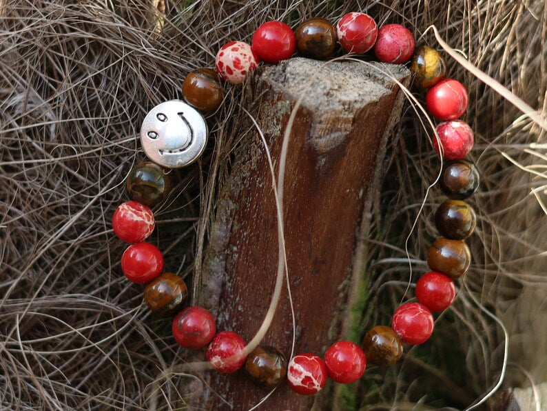 The Bāla Sagrahi Kids Collection. Children's Size Red Emperor Jasper 6 mm Gemstone Bracelet with Tiger eye and Happy Face Bead.