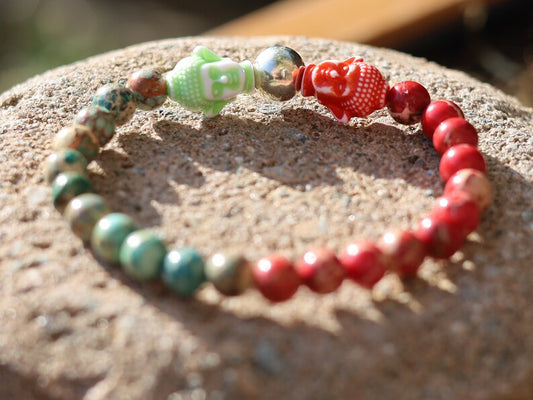 The Bāla Sagrahi Kids Collection. Children's Size Red and Turquoise Emperor Jasper 6 mm Gemstone Bracelet with 2x Buddha head.