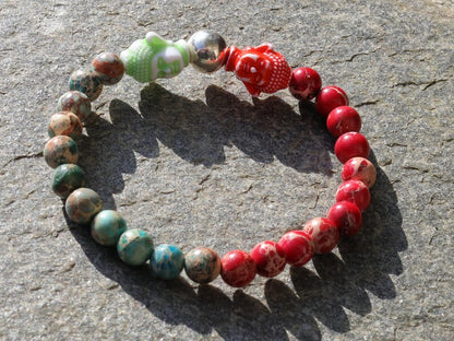 The Bāla Sagrahi Kids Collection. Children's Size Red and Turquoise Emperor Jasper 6 mm Gemstone Bracelet with 2x Buddha head.