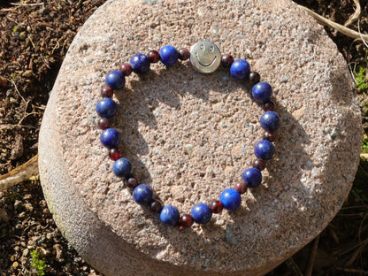 The Bāla Sagrahi Kids Collection. Children's Size Lapis Lazuli 6 mm Gemstone Bracelet with 4mm Red Garnet beads and Happy Face Bead.