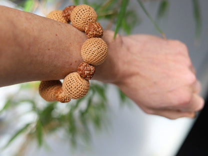Particularly large Walnut Hand carved Bracelet with Crochet bead light brown. A larger, crocheted bead in light brown.
