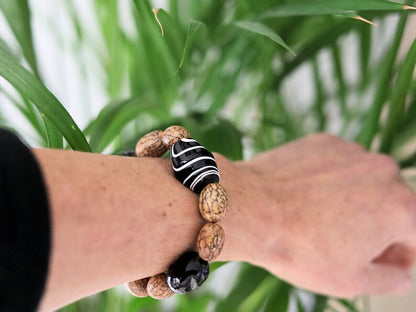 Handmade black/white striped clay beads combined with Undyed & Natural Bodhi Beads. which the Buddha sat when he attained Enlightenment