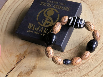 Handmade black/white striped clay beads combined with Undyed & Natural Bodhi Beads. which the Buddha sat when he attained Enlightenment
