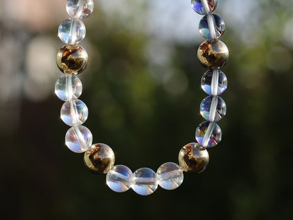 Mystic Aura Quartz Beads with Angel Aura and Metallook Beads Gold. the path of life becomes clear again and the stone gives joy, energy