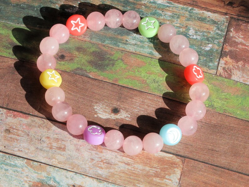 The Bāla Sagrahi Kids Collection. Children's Size 6 mm Rose Quartz Bracelet with kids acryl beads symbols. Gifts for kids!