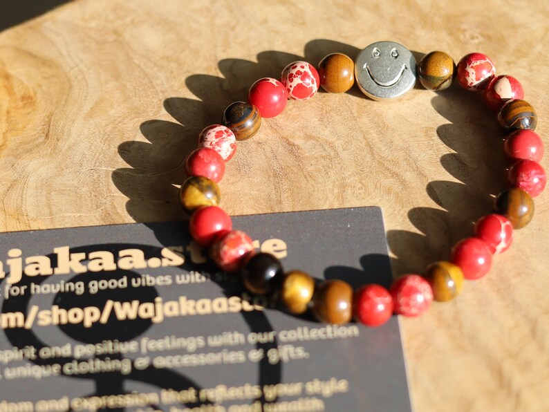 The Bāla Sagrahi Kids Collection. Children's Size Red Emperor Jasper 6 mm Gemstone Bracelet with Tiger eye and Happy Face Bead.