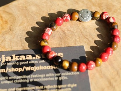 The Bāla Sagrahi Kids Collection. Children's Size Red Emperor Jasper 6 mm Gemstone Bracelet with Tiger eye and Happy Face Bead.
