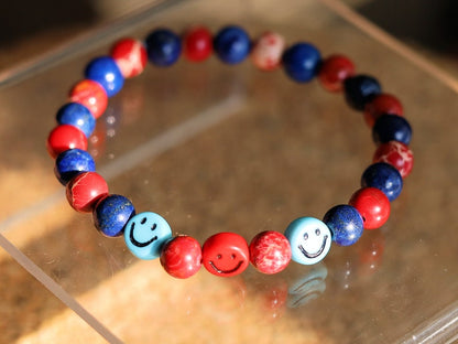 The Bāla Sagrahi Kids Collection. Children's Size Red Emperor Jasper 6 mm Gemstone Bracelet with Lapis Lazuli and Emoji Beads