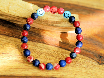 The Bāla Sagrahi Kids Collection. Children's Size Red Emperor Jasper 6 mm Gemstone Bracelet with Lapis Lazuli and Emoji Beads