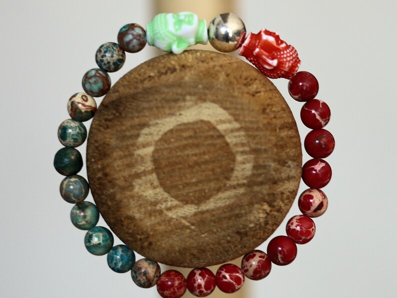 The Bāla Sagrahi Kids Collection. Children's Size Red and Turquoise Emperor Jasper 6 mm Gemstone Bracelet with 2x Buddha head.
