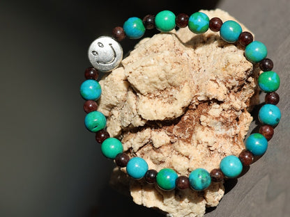 The Bāla Sagrahi Kids Collection. Children's Size Chrysocolla 6 mm Gemstone Bracelet with 4mm Red Garnet and Happy Face Bead.