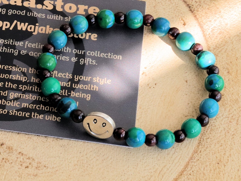 The Bāla Sagrahi Kids Collection. Children's Size Chrysocolla 6 mm Gemstone Bracelet with 4mm Red Garnet and Happy Face Bead.