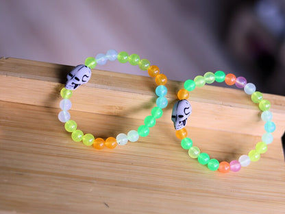 Bracelet 1 &2 - Luminous Acrylic Beads, different glow in the dark colors combined with UV Reactive Skull Beads.