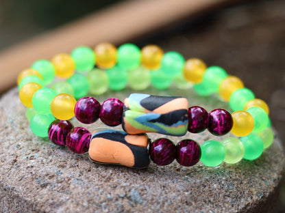 Glow in the dark - 2x bracelets mixed colored beads combined with clay Blacklight beads and ink purple color beads.