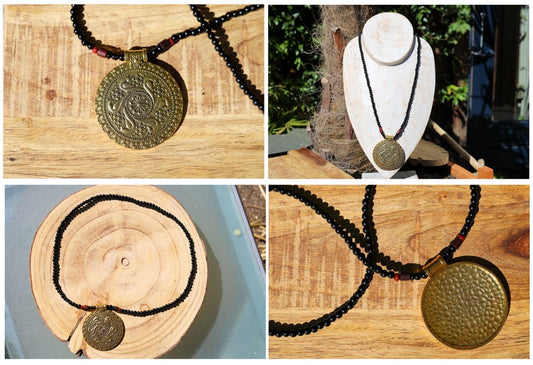 The Sumerian Medallion pendants Gold plated. The Swans measure 2.50", Parrots 3", Spirals 3