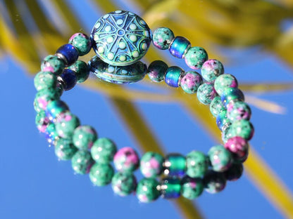 Color-changing Mirāja collection. Colorful Persian Jade bracelet with Mirage Mood Stargazer Coin Bead. unique colors in every environment