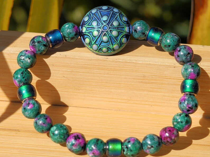Color-changing Mirāja collection. Colorful Persian Jade bracelet with Mirage Mood Stargazer Coin Bead. unique colors in every environment
