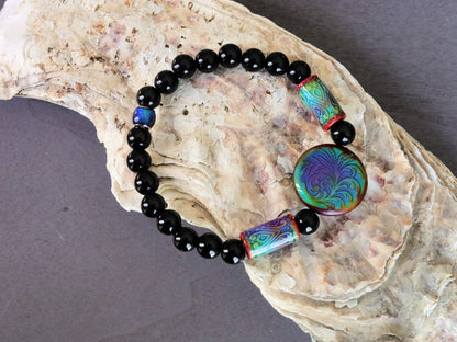 Color-changing Mirāja collection. Black Agates Carnelian bracelet with Mirage Mood Fountain Fern Coin Bead. Mirage Mood Glow Nouveau Bead.