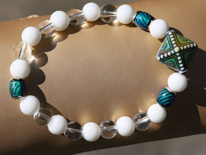 Color-changing Mirāja collection.  White Onyx  Agate bracelet with Mirage Mood Northern Lights Diamond Bead and Color Changing barrel beads