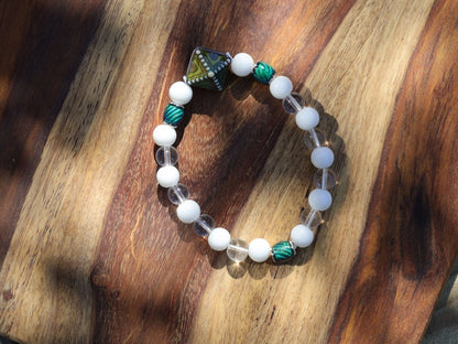 Color-changing Mirāja collection.  White Onyx  Agate bracelet with Mirage Mood Northern Lights Diamond Bead and Color Changing barrel beads