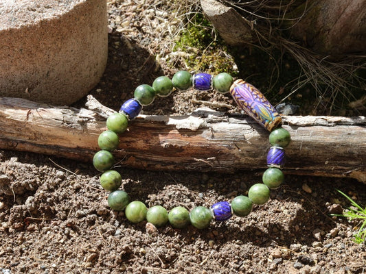 Color-changing Mood Mirāja collection. Green Chalcedony Stone bracelet with Mirage Mood Daisy Ray Bead and  Color Changing barrel beads.