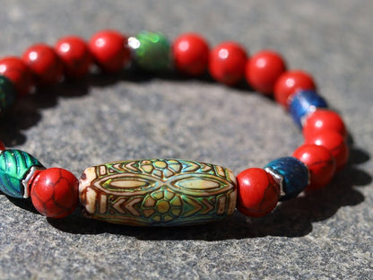 Color-changing Mirāja collection.  Natural Stone Red Howlite Turquoise bracelet with Mirage Mood Daisy Ray. Creating unique colors.