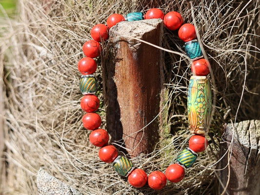 Color-changing Mirāja collection.  Natural Stone Red Howlite Turquoise bracelet with Mirage Mood Daisy Ray. Creating unique colors.