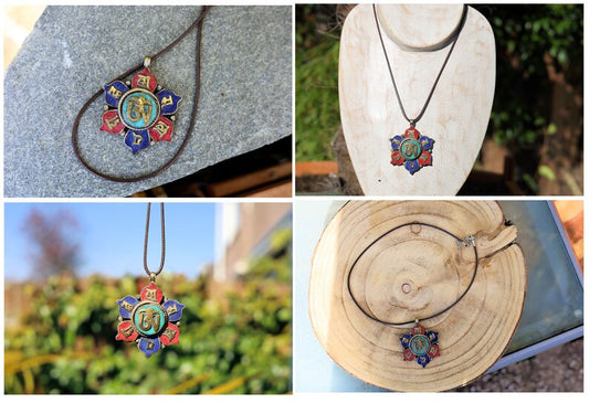 Unique Vintage Tibetan lotus flower dharma wheel brass pendant with turquoise , lapis and coral inlay. Tibetan OM inscribed in brass in center of pendant . Tibetan six syllable Om mantra "Om mani padme hum " on the petals. .