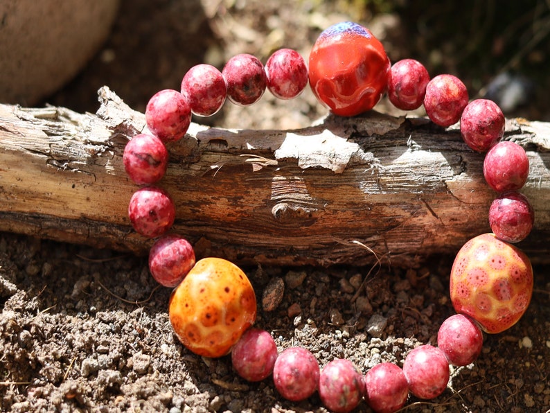 Unique Gorgeous Aggie Maroon Jade Beads bracelet with 16 mm red/ orange beads. Meaningful & symbolic merchandise. Durable stretchy cord